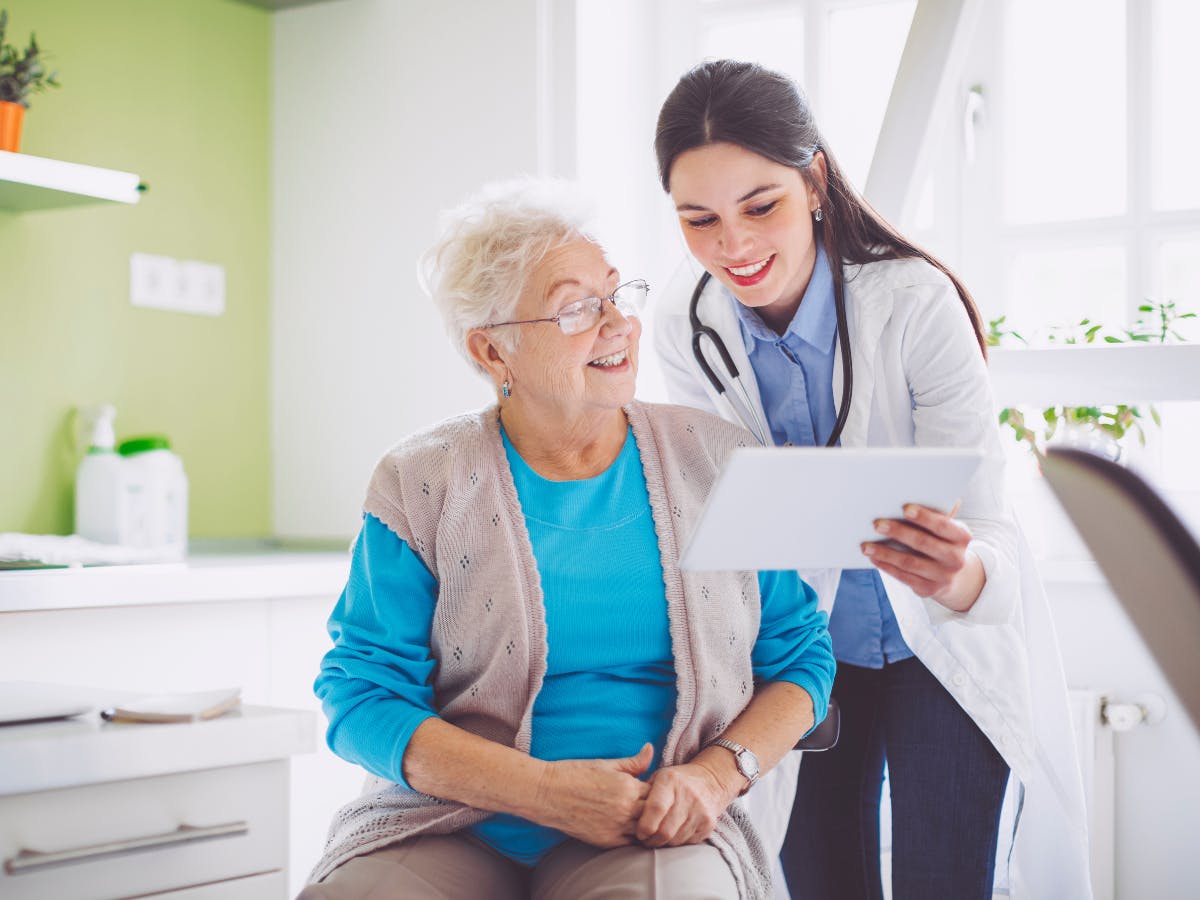 Nurse practitioner with elderly patient