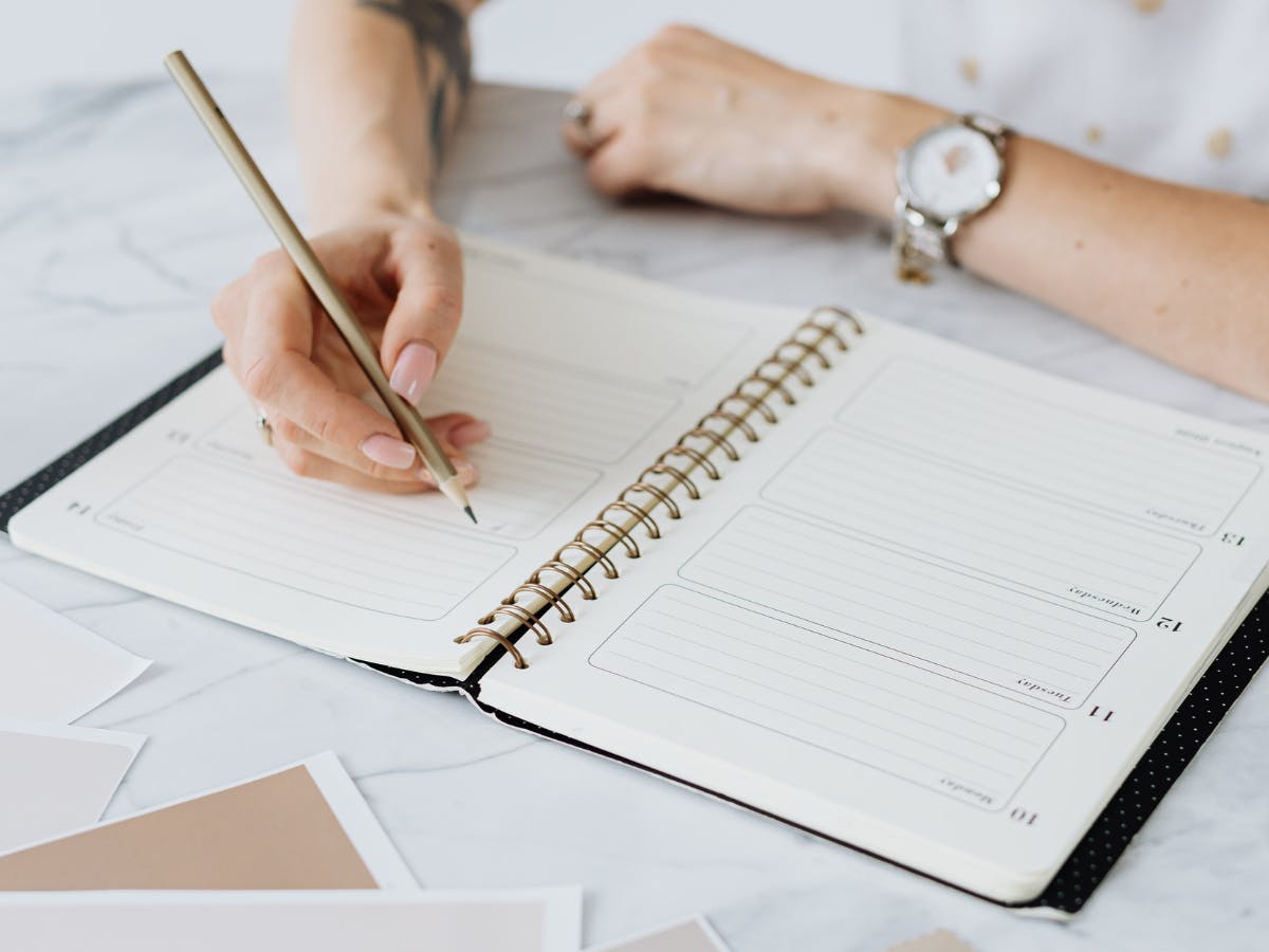 Nursing student using planner in nursing school