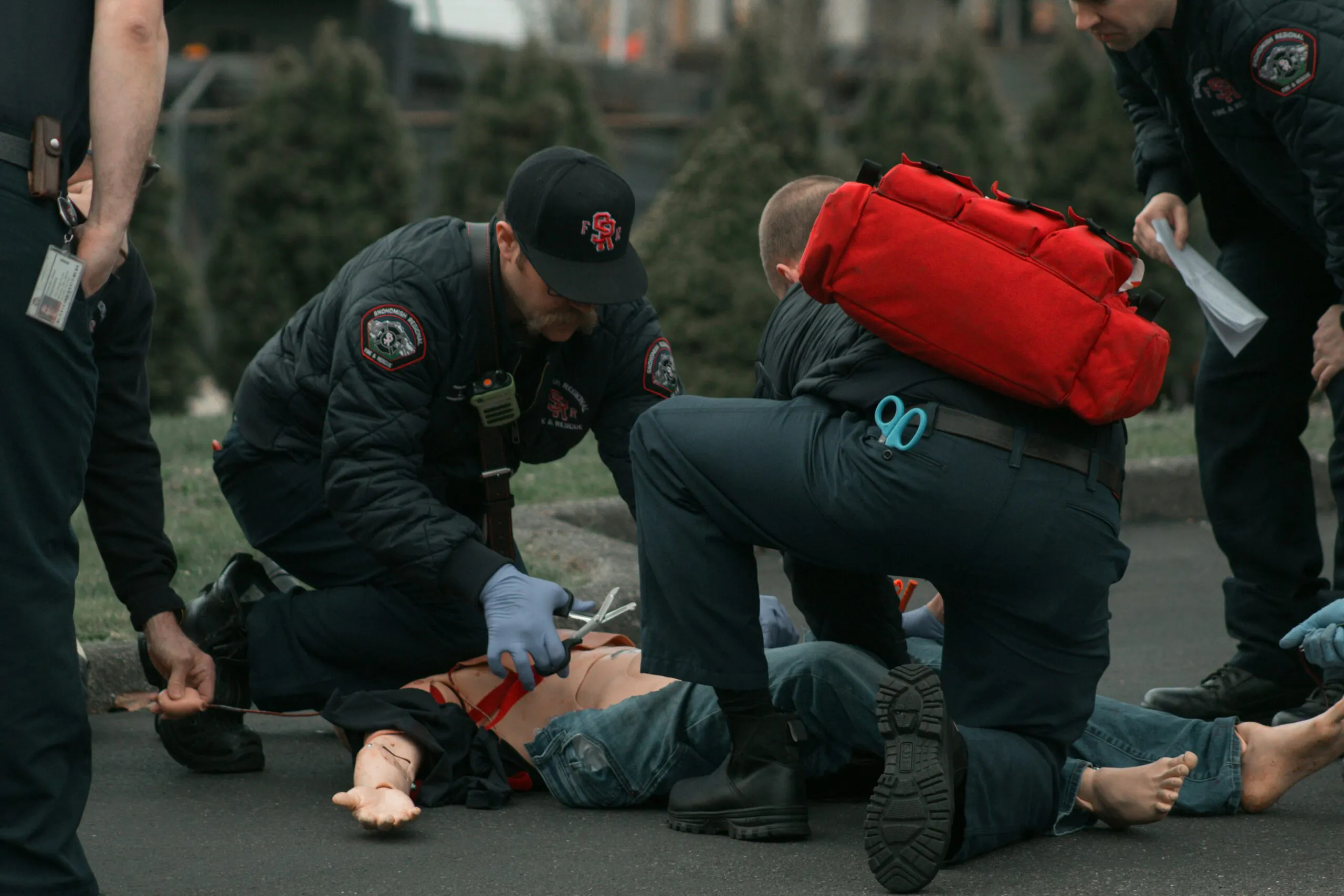 Emergency medical technicians providing care to a patient at the scene