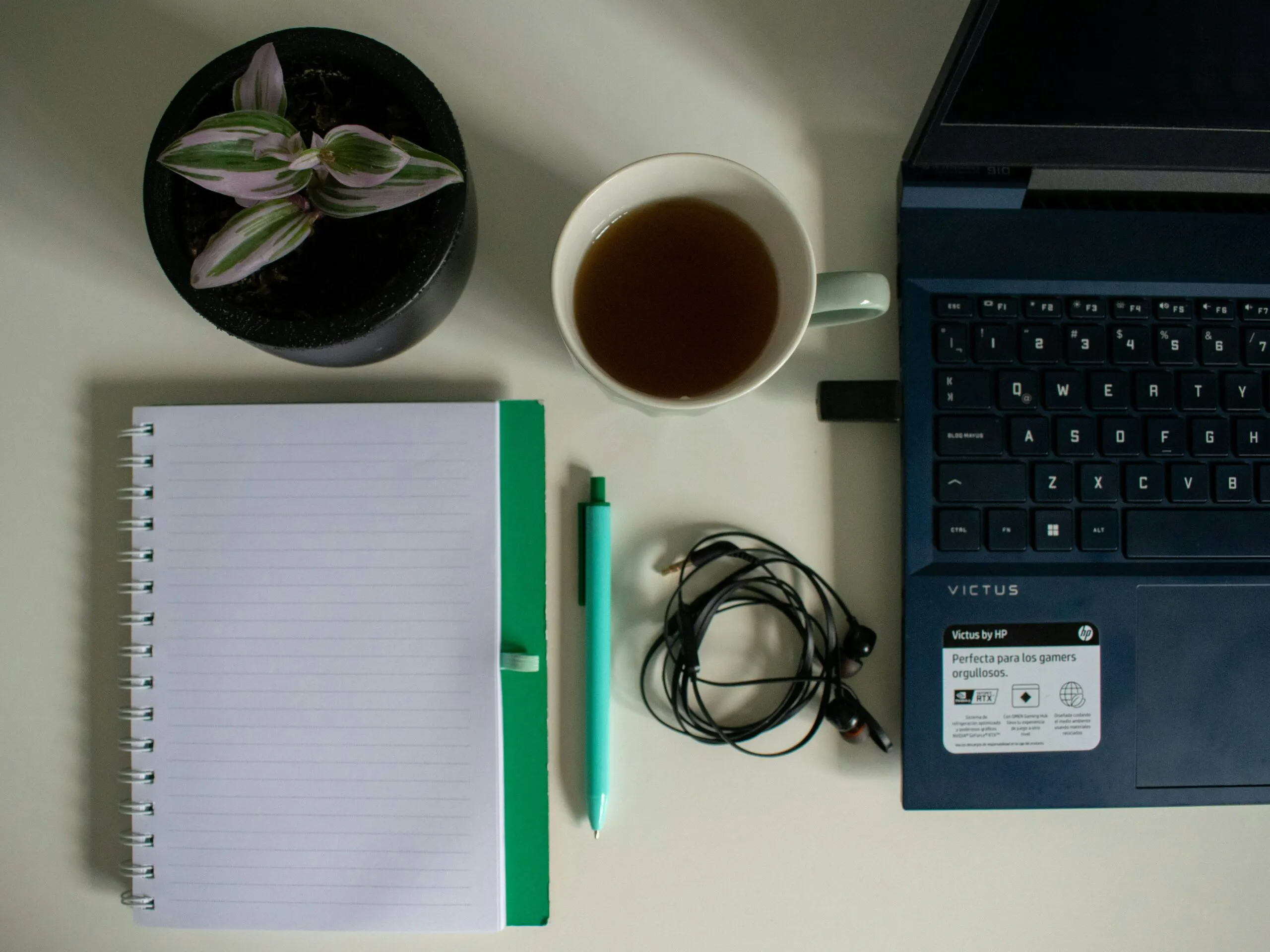 Study desk with notebook and laptop used by a working nursing student