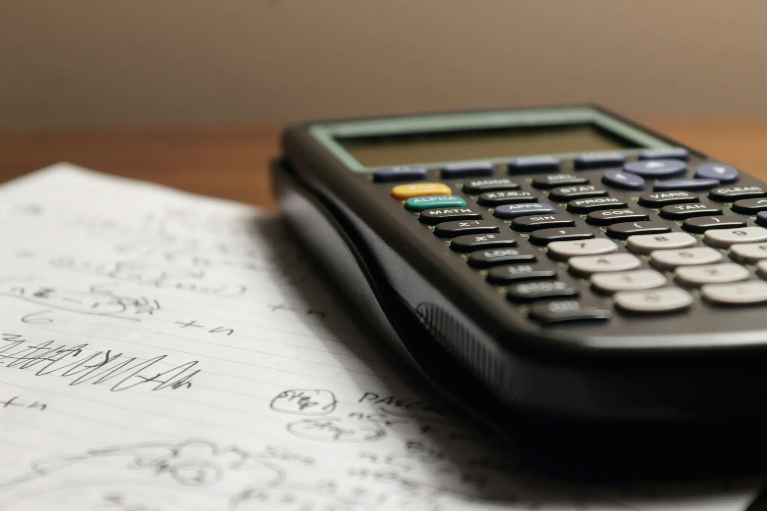 Calculator on handwritten math notes for TEAS 7 math practice and nursing school exam prep