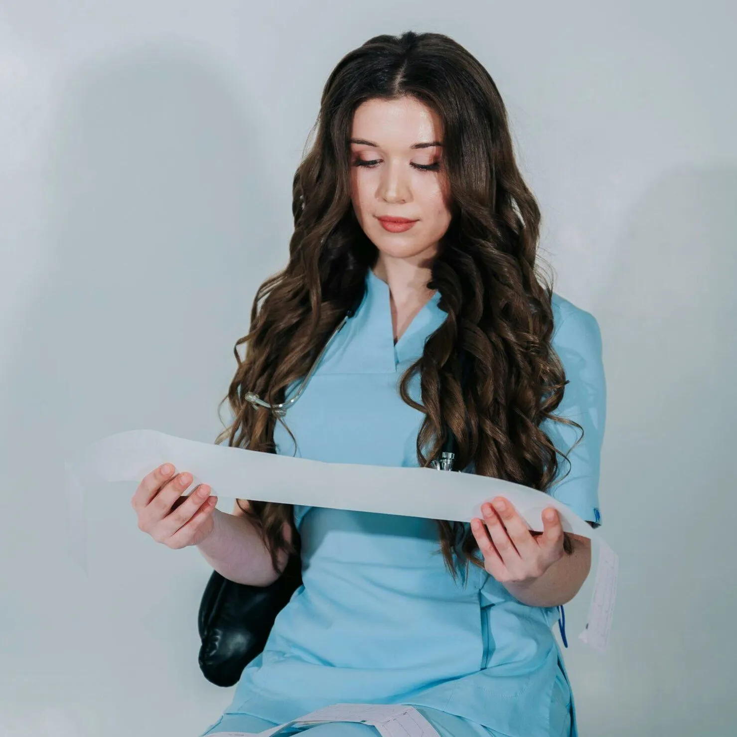 New nurse reviewing patient information during a hospital shift