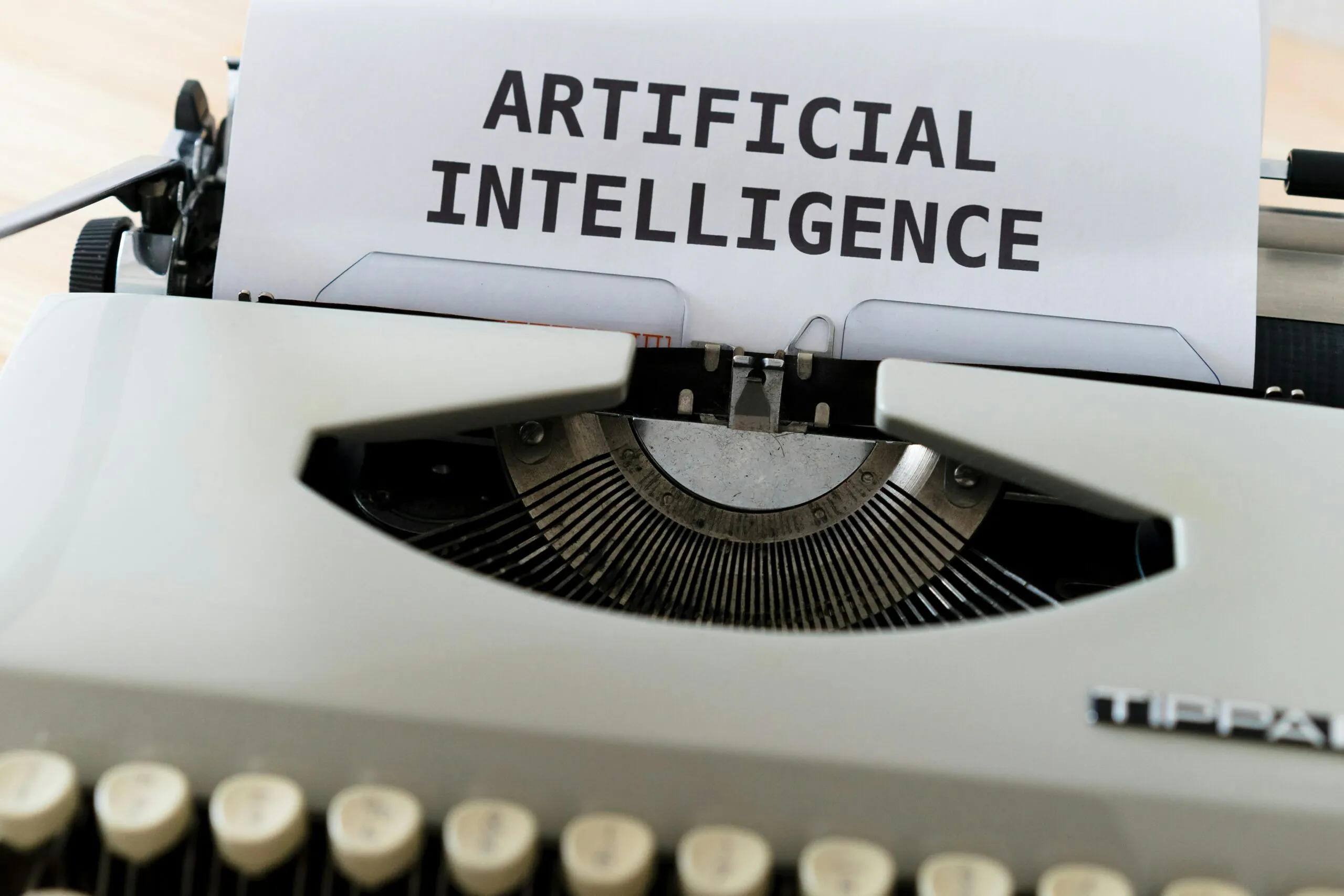 Typewriter with a page reading "Artificial Intelligence," representing AI on the ANCC FNP exam for the first time in 2026