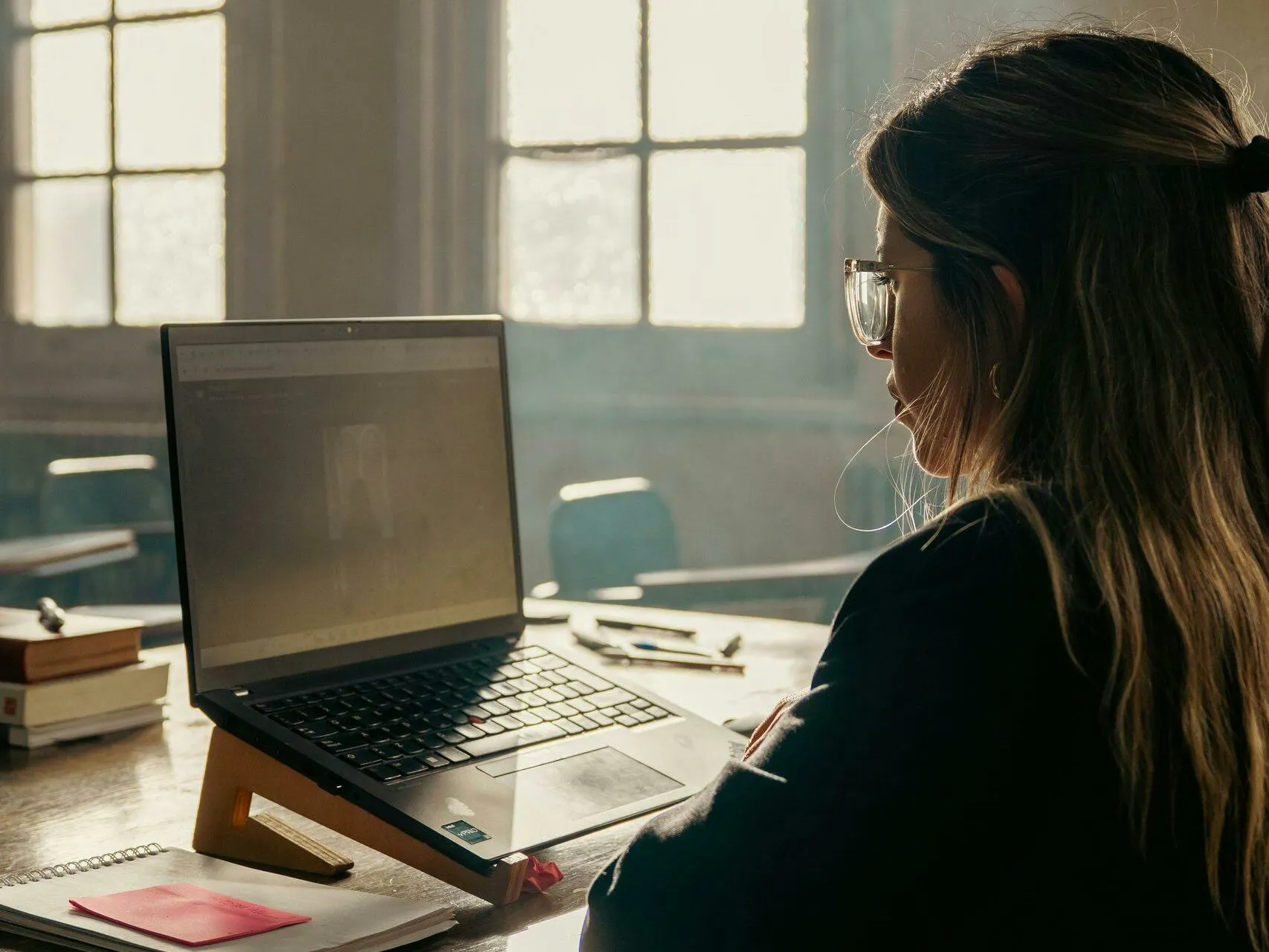 Nurse studying at a laptop while preparing for the CCRN exam and its current blueprint