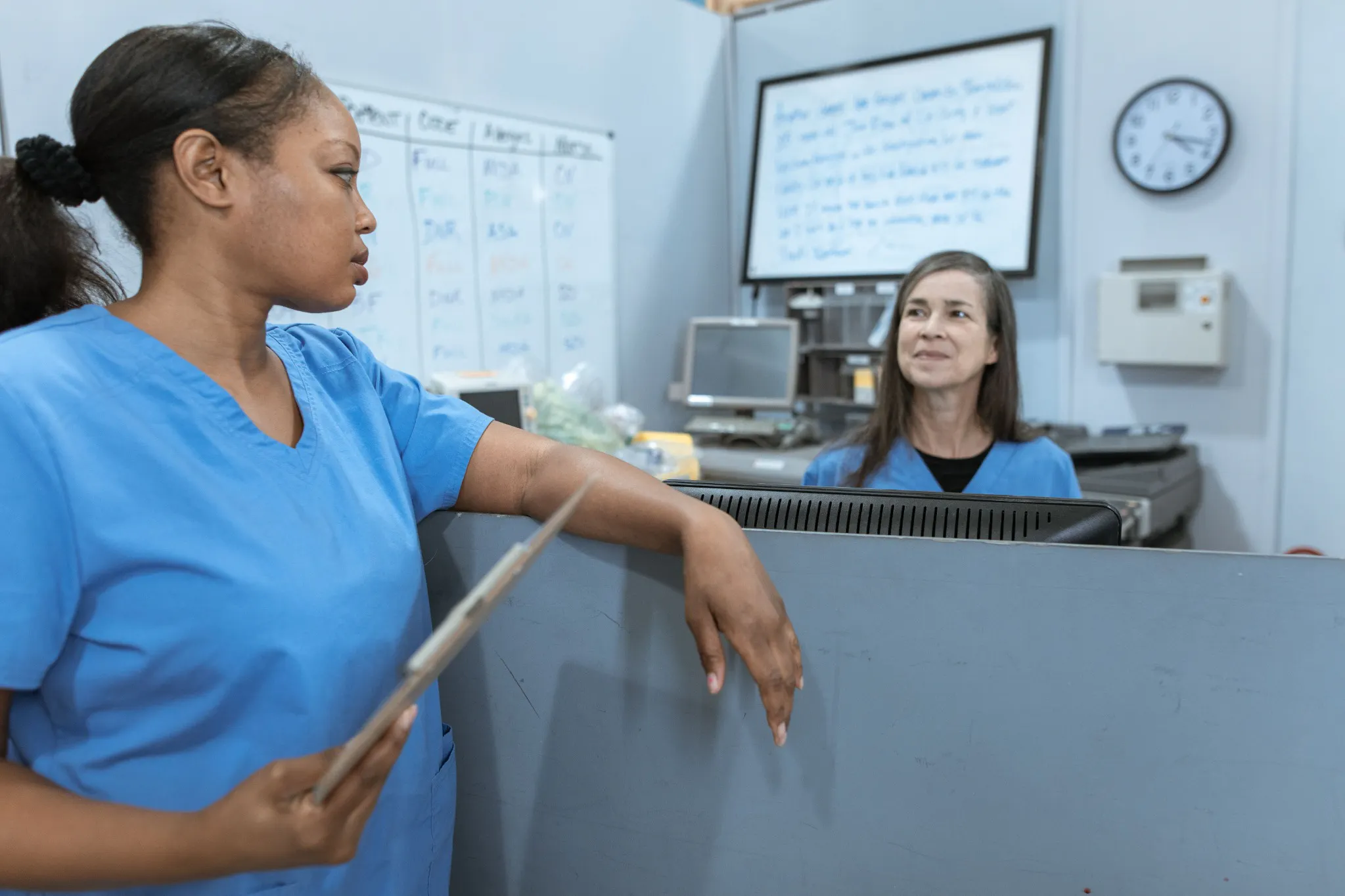 nclex-rn-delegation-questions-team-communication.jpg	Two healthcare professionals communicating at a workstation, illustrating teamwork relevant to NCLEX RN delegation questions