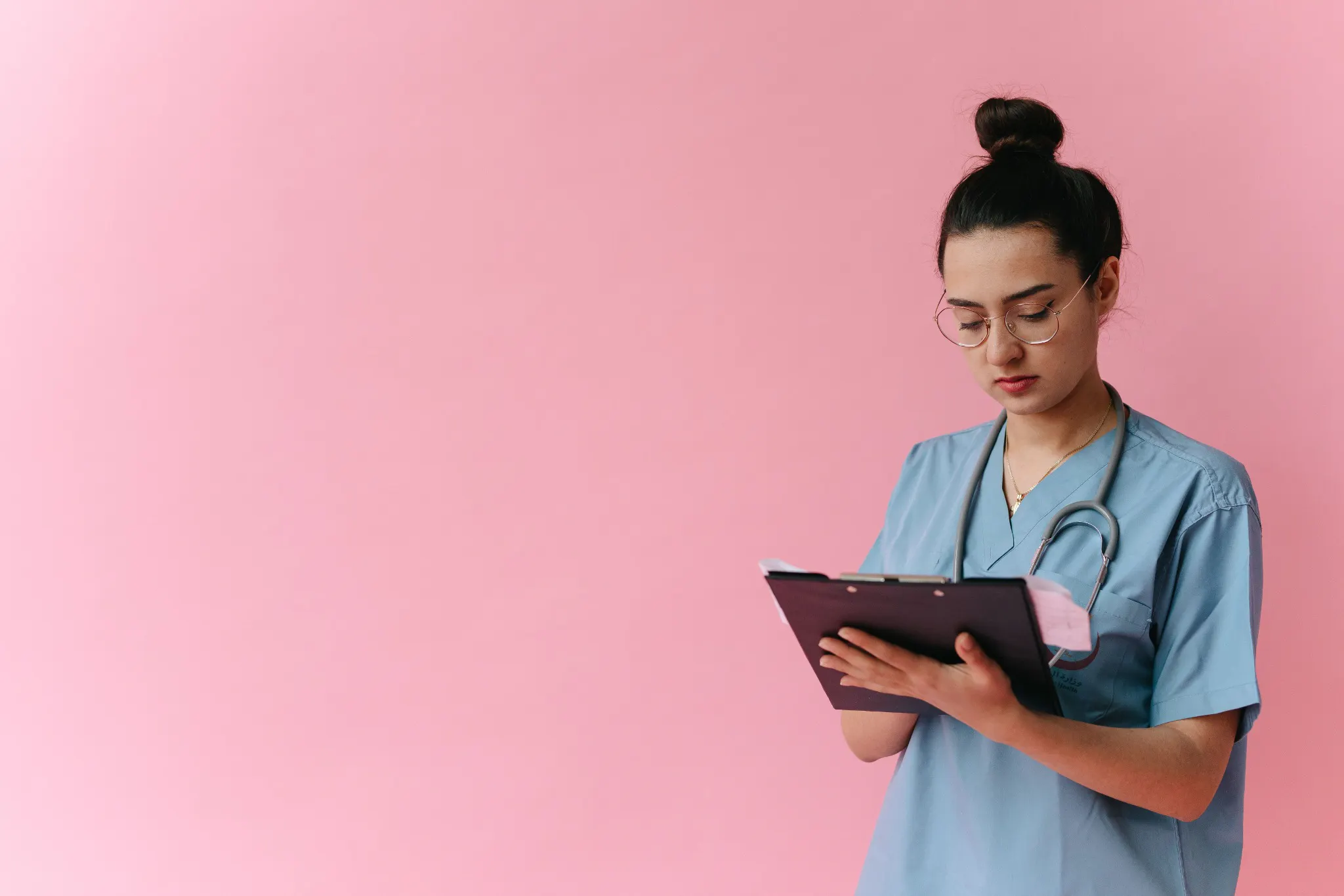 ngn-nclex-questions-clinical-notes.jpg Healthcare professional reviewing a clipboard, illustrating the clinical information review used in NGN NCLEX questions.